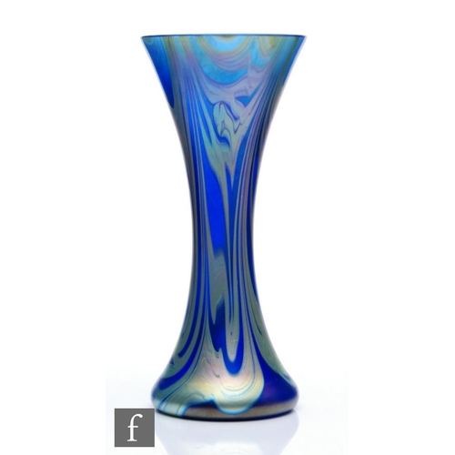 1141 - Okra - A contemporary studio glass vase of waisted sleeve form, the blue ground with trails of golde... 