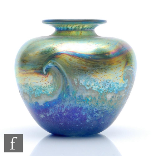 1241 - Norman Stuart Clarke - A later 20th Century studio glass vase in the Seascape pattern, of compressed... 