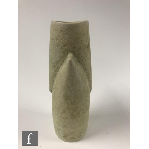 1186 - Chris Carter - A studio pottery vessel of triangular shaped form glazed in a pale oatmeal, seal mark... 