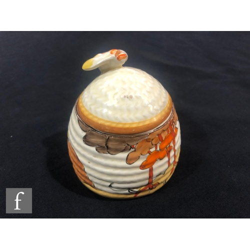 244 - Clarice Cliff - Coral Firs - A small size Beehive honey pot circa 1933, hand painted with a tonal br... 