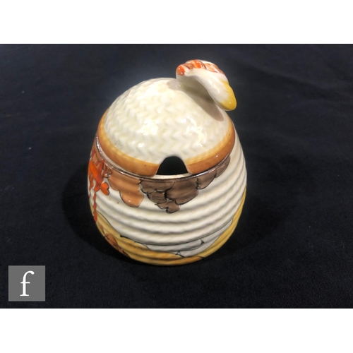 244 - Clarice Cliff - Coral Firs - A small size Beehive honey pot circa 1933, hand painted with a tonal br... 