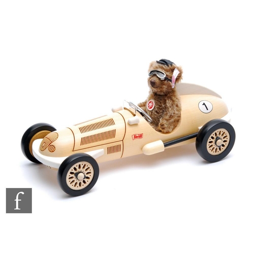 870 - A Steiff 038358 Classic Teddy Bear with Silver Arrow Car, caramel mohair teddy bear wearing cap and ... 