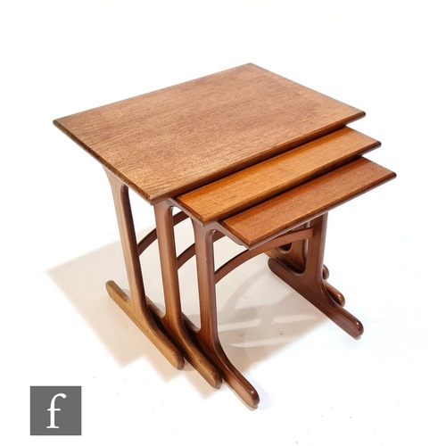 1004 - Victor B. Wilkins - G-Plan - A nest of three early 1970s teak rectangular occasional nesting tables,... 