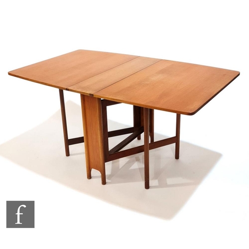 997 - Tom Robertson - McIntosh of Kirkcaldy - A teak drop leaf dining table with strut type end supports a... 