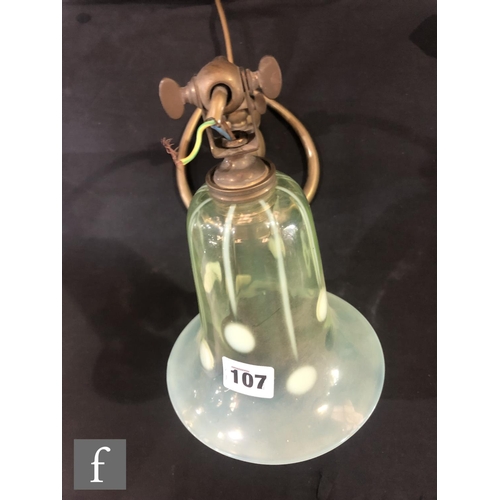 107 - W A S Benson - An early 20th Century Arts and Crafts brass lamp bass with heart shaped base and an a... 