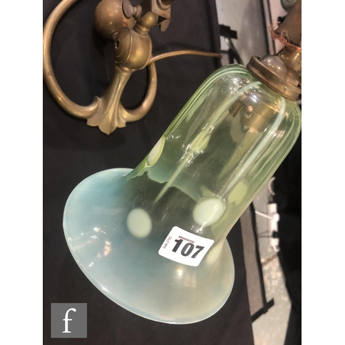 107 - W A S Benson - An early 20th Century Arts and Crafts brass lamp bass with heart shaped base and an a... 