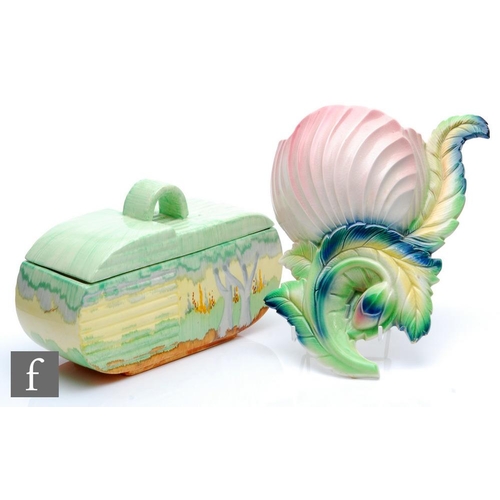 125 - A 1930s Art Deco Beswick shape 170 biscuit box and cover decorated with a hand painted landscape in ... 