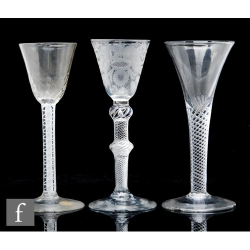 321 - A group of 18th Century drinking glasses to comprise an air twist example circa 1750, with drawn tru... 