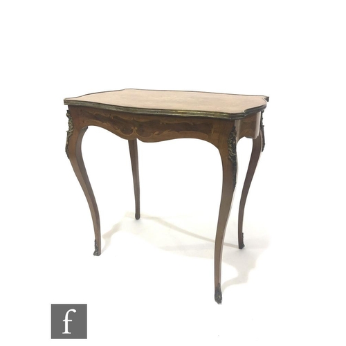 1312 - A 20th Century Louis XIV style inlaid walnut centre table, the floral inlaid top over a shaped friez... 