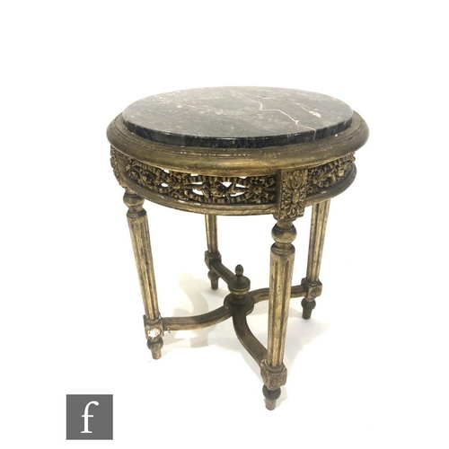 1314 - A late 19th Century French circular painted gilt jardiniere, on fluted legs united by a swept stretc... 