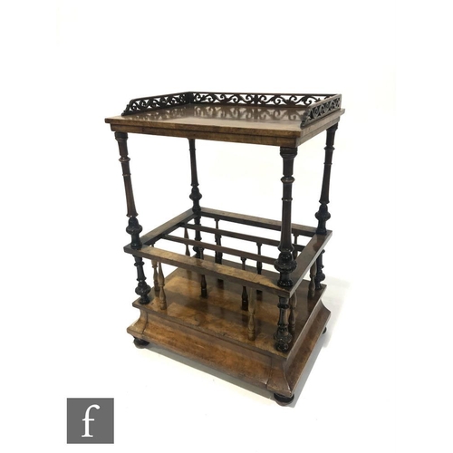 1316 - A Victorian figured walnut music Canterbury, the gallery back over three divisions, turned supports,... 