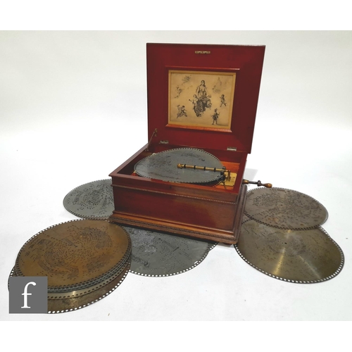 1084 - A 15 1/2 inch Regina disc musical box, serial number 14042, duplex combs, in mahogany beaded edge ca... 