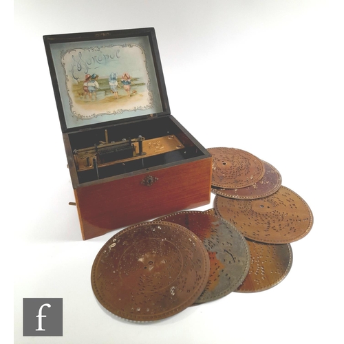 1085 - A Monopol disc musical box playing 7 1/2 inch discs, single comb, in walnut transfer case, width 26c... 