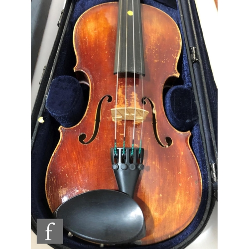 574 - A late 19th early 20th Century violin, length 34cm, with bow, in modern blue zip case and with origi... 