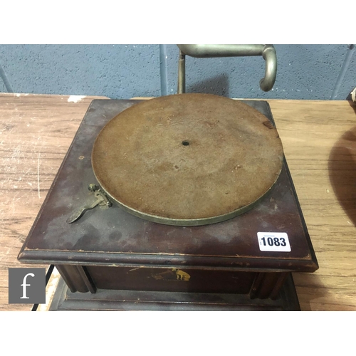 1083 - An HMV gramophone with original wooden horn, exhibition sound box on mahogany base A/F and a leather... 