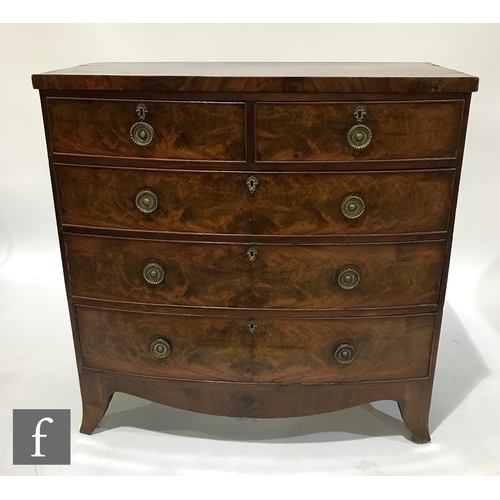 1315 - A George III mahogany bow front chest of two short and three long drawers, circular brass drop handl... 