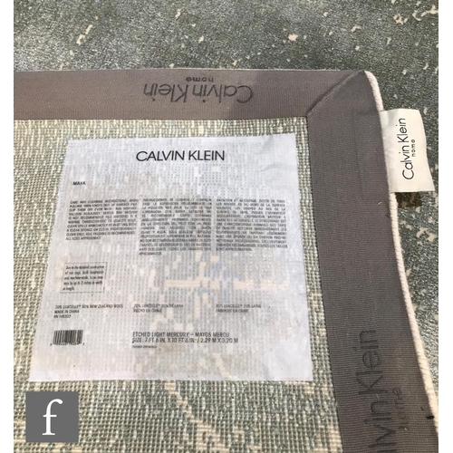 1325 - A contemporary Calvin Klein Maya rug, etched light mercury, 229cm x 320cm, 70% luxcelle, 30% New Zea... 