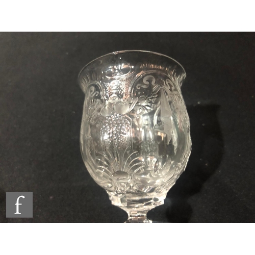 231 - An early 20th Century Thomas Webb & Sons wine glass with a heavily cut thistle bowl decorated wi... 