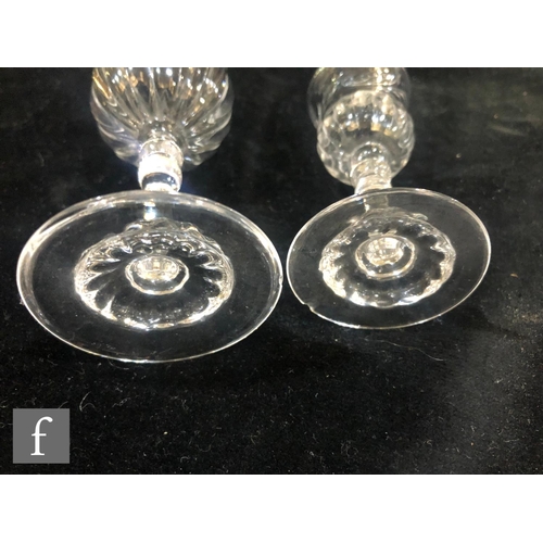 266 - A pair of Stevens & Williams clear crystal decanters circa 1910, the slender bottle form body wi... 