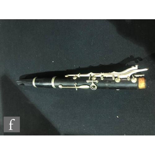 567 - A pair of early 20th Century clarinets by Buffet A Paris, ebonised case with nickel fittings, in plu... 