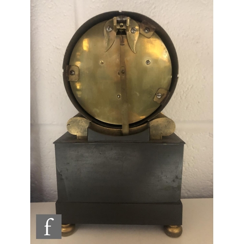 547 - A 19th Century French Empire style mantle clock, the circular brass movement over a mask embellishme... 