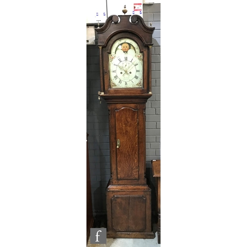 1329 - An early 19th Century oak longcase clock with an eight-day movement, the 12 inch broken arch moonpha... 