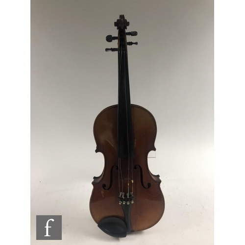 514 - A 20th Century violin labelled JTL Vitouse, length 36cm, with two bows, cased.