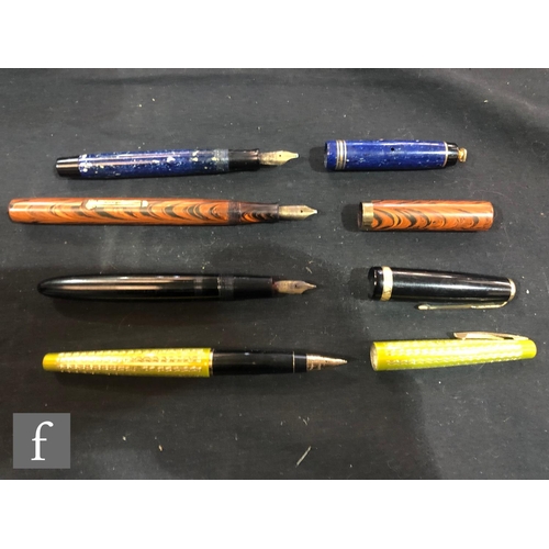 609 - A black cased Parker Duofold fountain pen, another in blue marble effect case and original box, a Wa... 