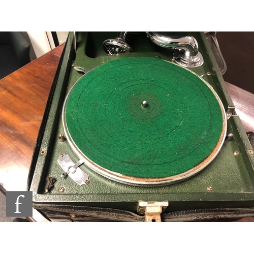 585 - A portable gramophone, HMV model 102C, in green case with 5A soundbox, retains leather outer cover.