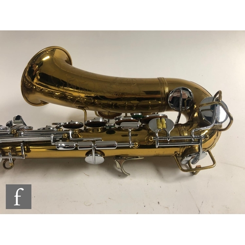 635 - A British made brass saxophone by Lafleur London, with mouth piece, in plush lined case, width 59cm.