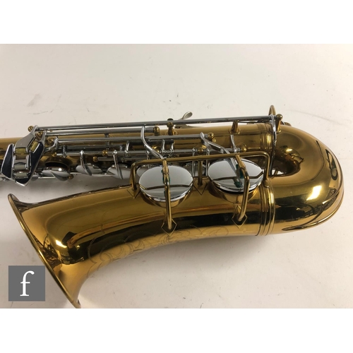 635 - A British made brass saxophone by Lafleur London, with mouth piece, in plush lined case, width 59cm.