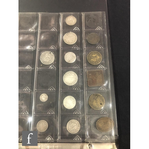 597 - A small album of George III to George VI silver, nickel and copper coinage including tokens. (qty)