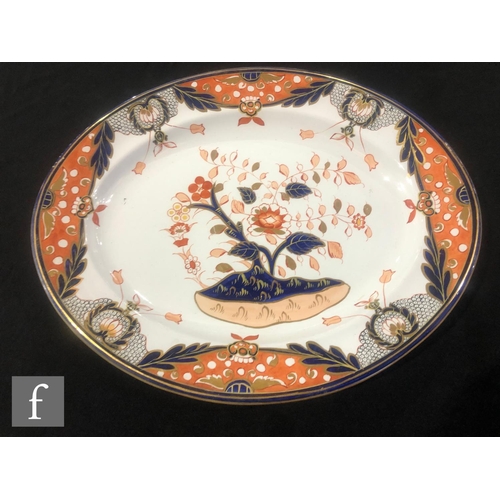 75 - A large 19th Century Davenport Chinoiserie meat plate decorated in the Imari palette with a stylised... 