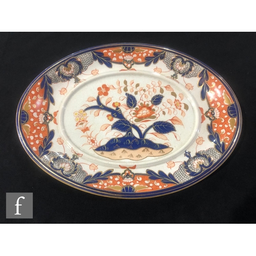 75 - A large 19th Century Davenport Chinoiserie meat plate decorated in the Imari palette with a stylised... 