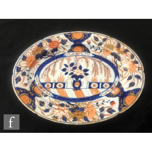 75 - A large 19th Century Davenport Chinoiserie meat plate decorated in the Imari palette with a stylised... 