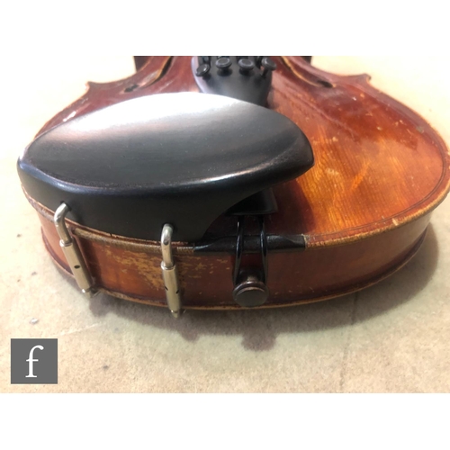 574 - A late 19th early 20th Century violin, length 34cm, with bow, in modern blue zip case and with origi... 