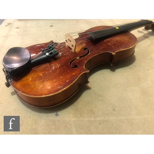 574 - A late 19th early 20th Century violin, length 34cm, with bow, in modern blue zip case and with origi... 