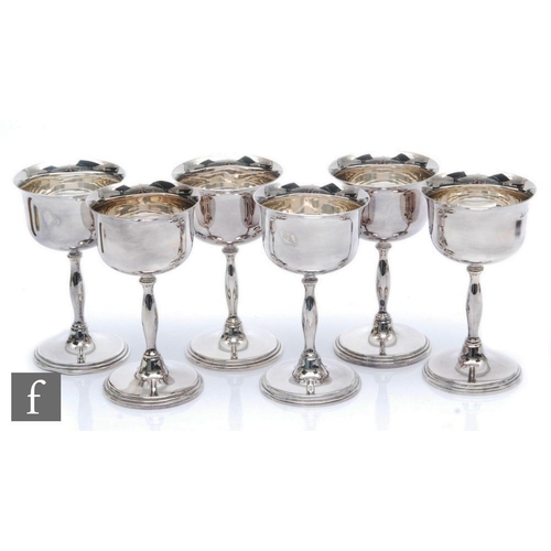 107 - A set of six hallmarked silver goblets, total weight 27.5oz, heights 14cm, circular stepped foot bel... 