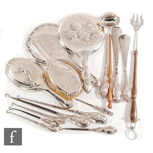 111 - A small parcel lot of assorted hallmarked silver items to include a modern toasting fork and toddy l... 