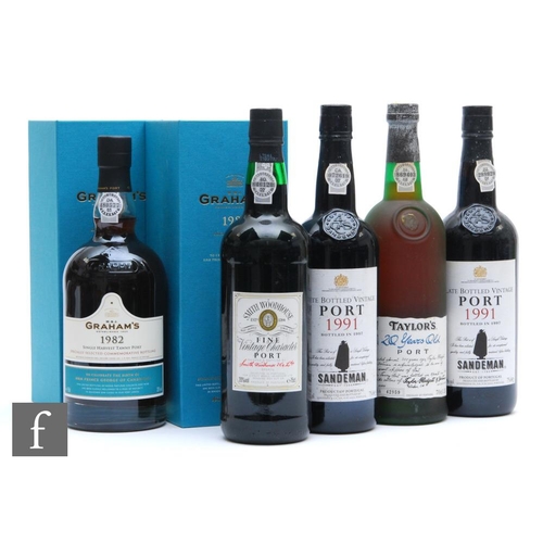 1150 - A collection of vintage ports, to include two boxed bottles of Graham's 1982 Tawny port, a limited b... 