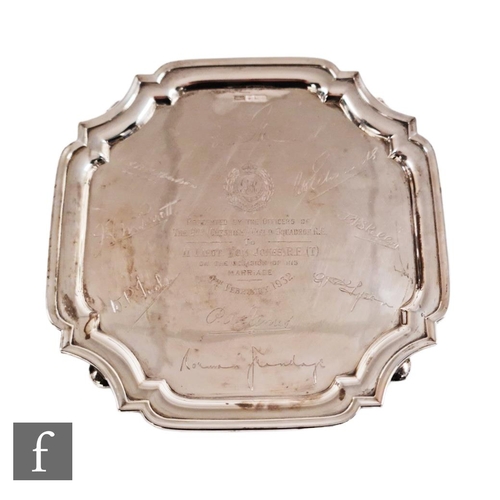 121 - A hallmarked silver canted square salver with presentation engravings to Lieut Tom Jones, weight 16.... 