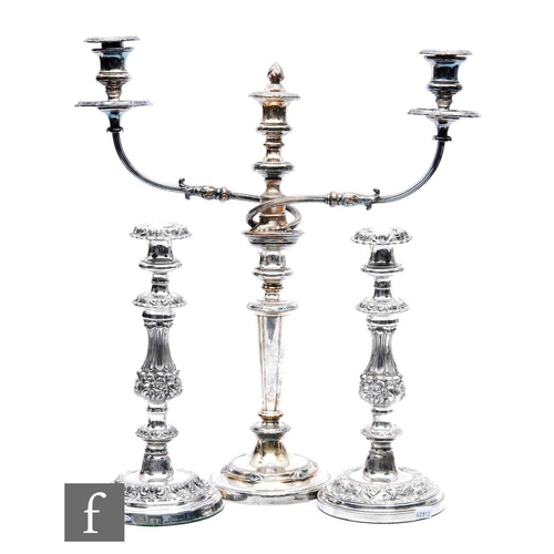 125 - A pair of 19th Century silver plated candlesticks, circular bases with foliate decoration below knop... 