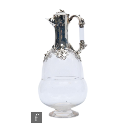 132 - A Victorian hallmarked silver and clear glass claret jug, the glass body formed as an acorn, below s... 