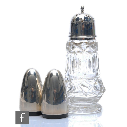 139 - A modern hallmarked silver salt and pepper pot of plain form, heights 7cm, with a silver topped cut ... 