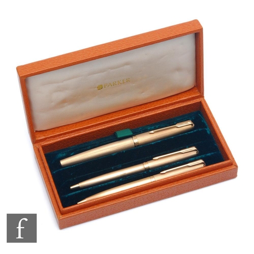 157 - A cased set of three 9ct hallmarked Parker writing implements, a fountain pen, a biro and a pencil, ... 