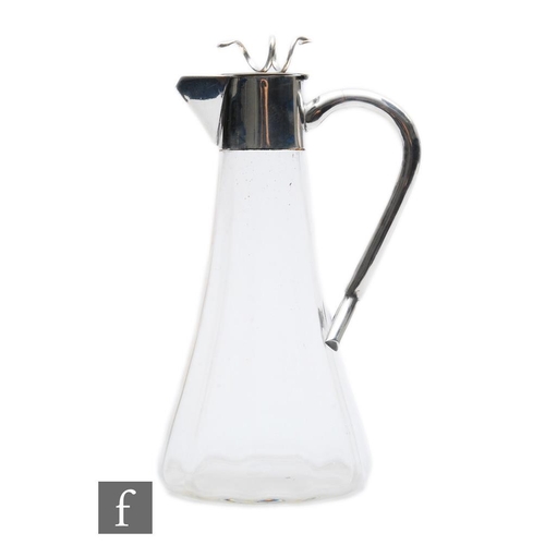 16 - An early 20th Century silver plated and clear glass claret jug, tapering fluted glass body below pla... 