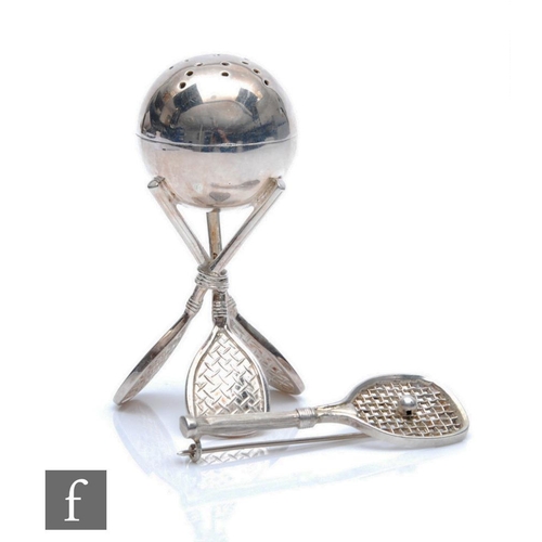 189 - A silver plated pepper pot modelled as three tennis rackets and a ball, height 6.5cm, with a silver ... 