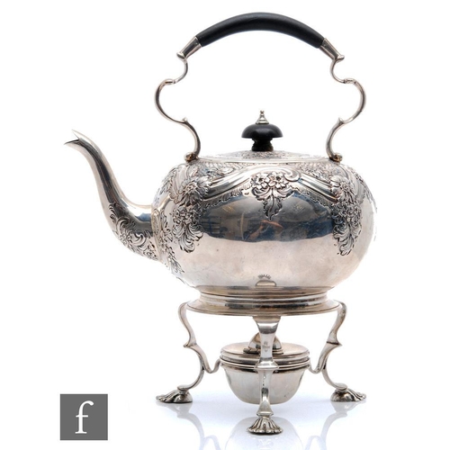 2 - A hallmarked silver spirit kettle with conforming stand and burner, the stand raised on three pad fe... 