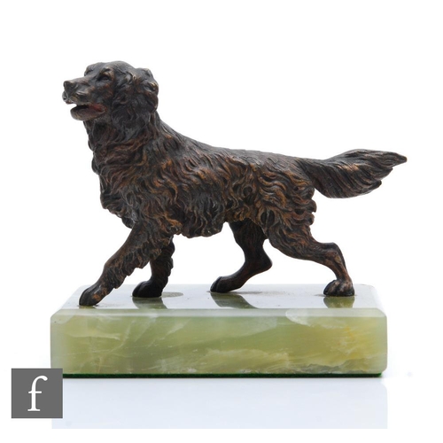 205 - A bronze study of a standing spaniel mounted to a green onyx rectangular base, length 11cm, S/D.