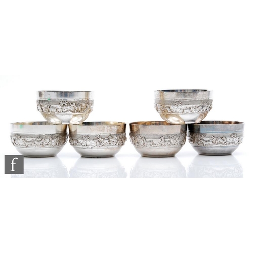 22 - Six low grade Indian silver small bowls each decorated with a embossed hunting scene, total weight 2... 